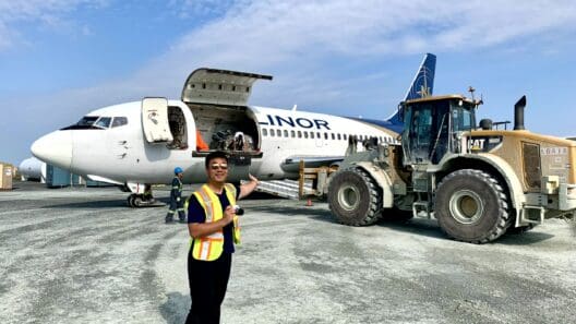 a man standing in front of an airplane