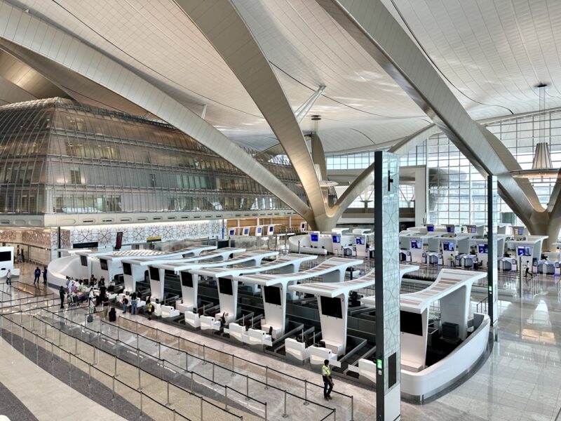 a group of people in a large airport terminal