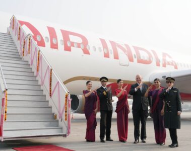 a group of people in uniform standing in front of a plane