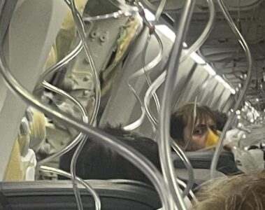 a person in a mask on a plane