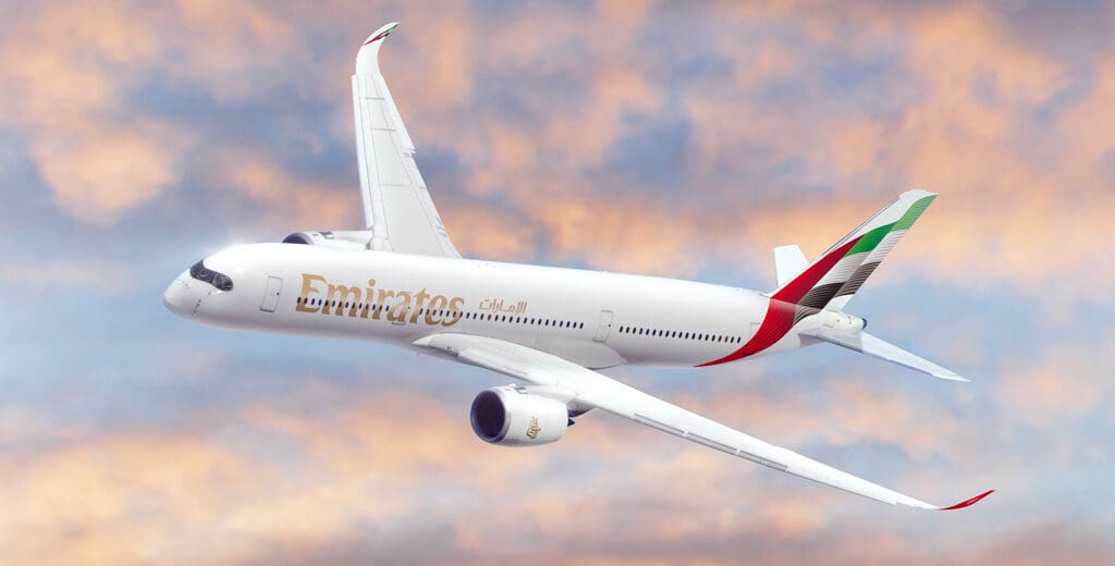 a white airplane flying in the sky