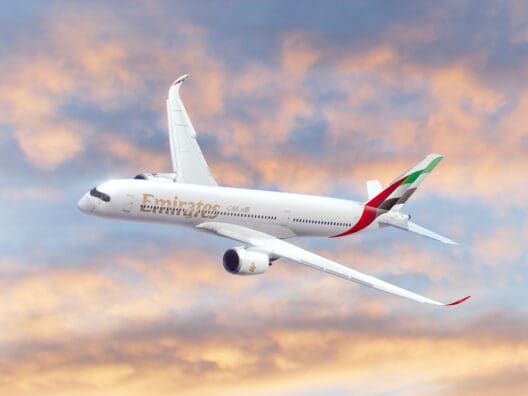 a white airplane flying in the sky