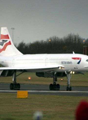 a white airplane on a runway