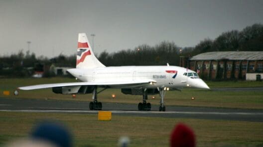 a white airplane on a runway