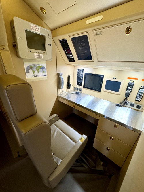 a desk with a chair and a monitor