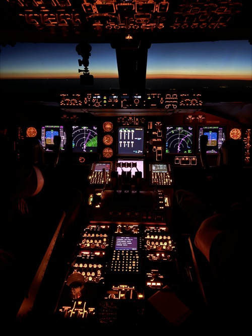 the cockpit of an airplane with lights and instruments