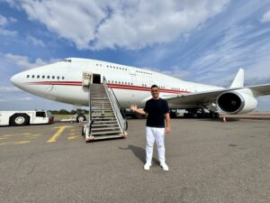 a man standing in front of a plane