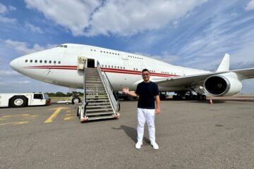 a man standing in front of a plane