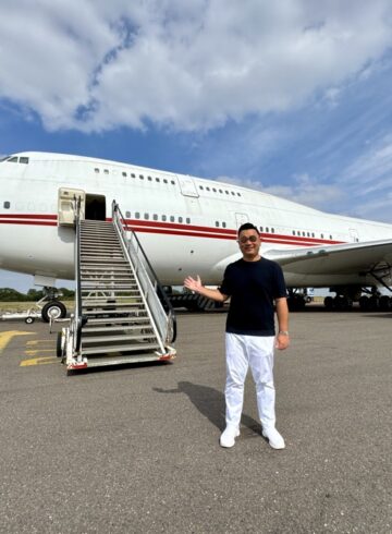 a man standing in front of a plane