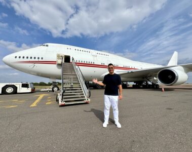 a man standing in front of a plane