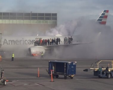 people standing on the wing of an airplane