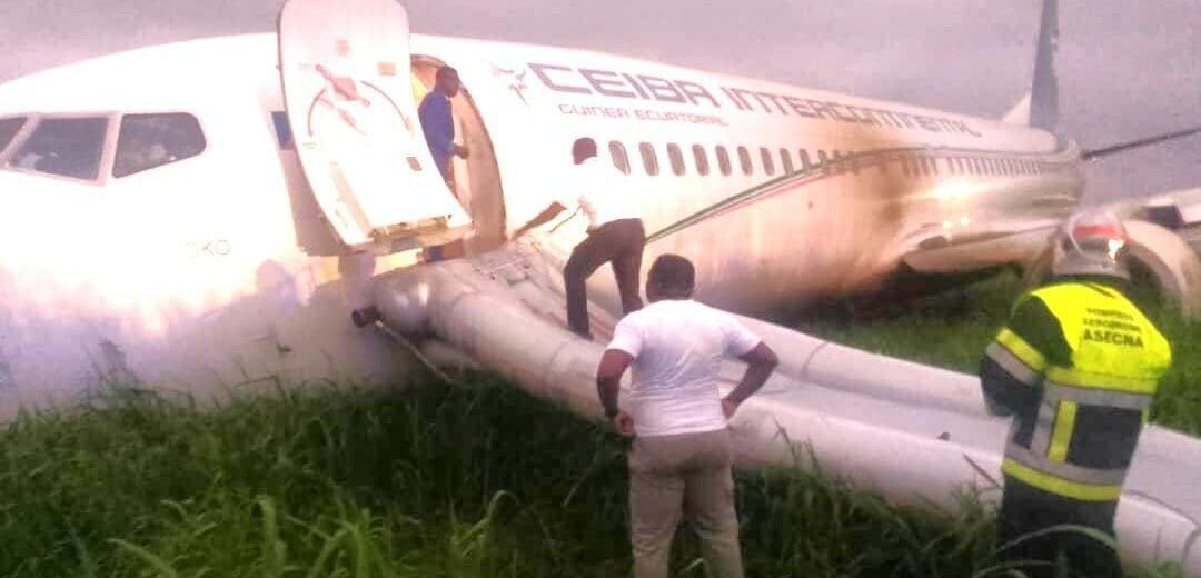 a man standing on the side of an airplane