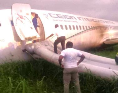 a man standing on the side of an airplane