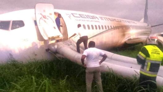 a man standing on the side of an airplane