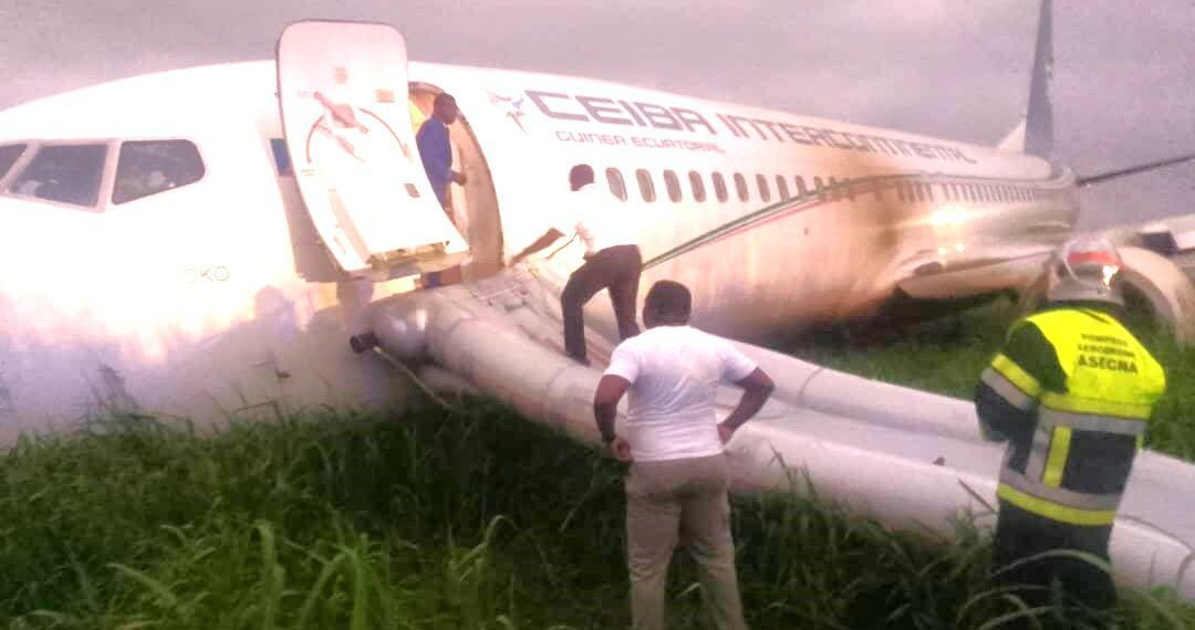 a man standing on the side of an airplane