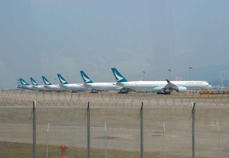 a row of airplanes on a runway