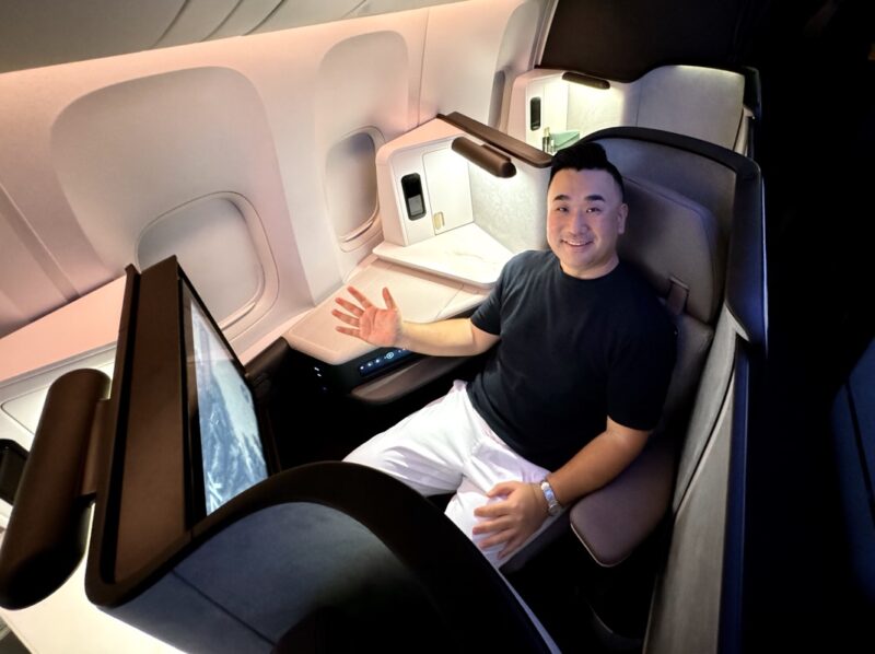 a man sitting in a chair in a plane