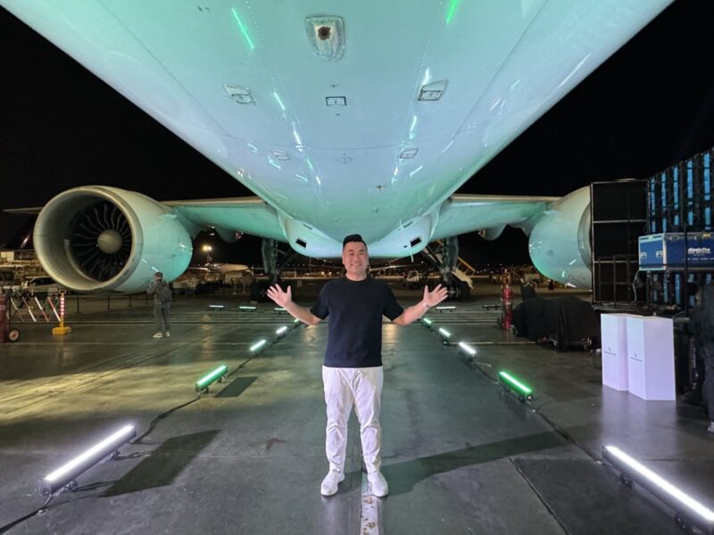 a man standing in front of an airplane