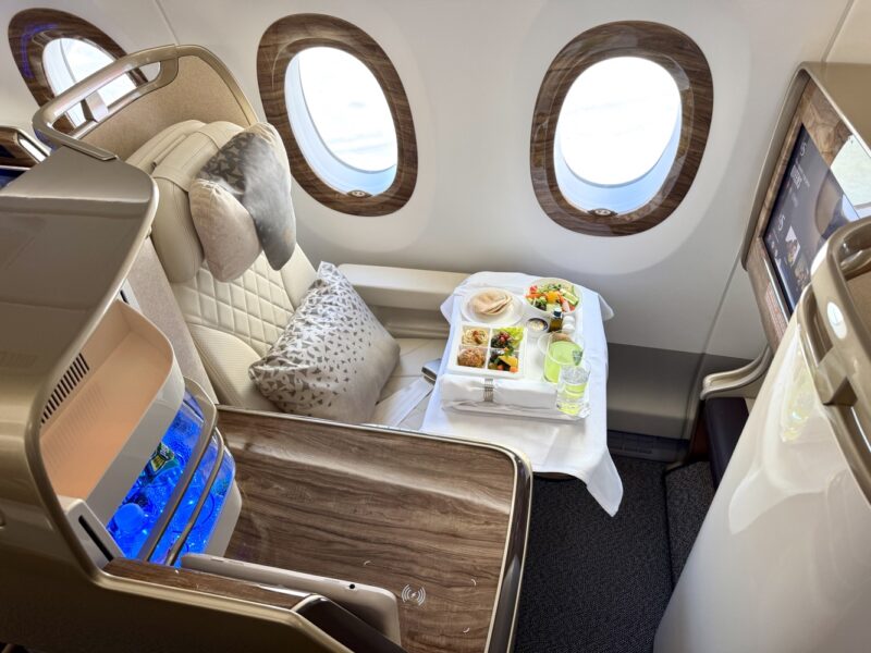 a tray of food on a table in a plane