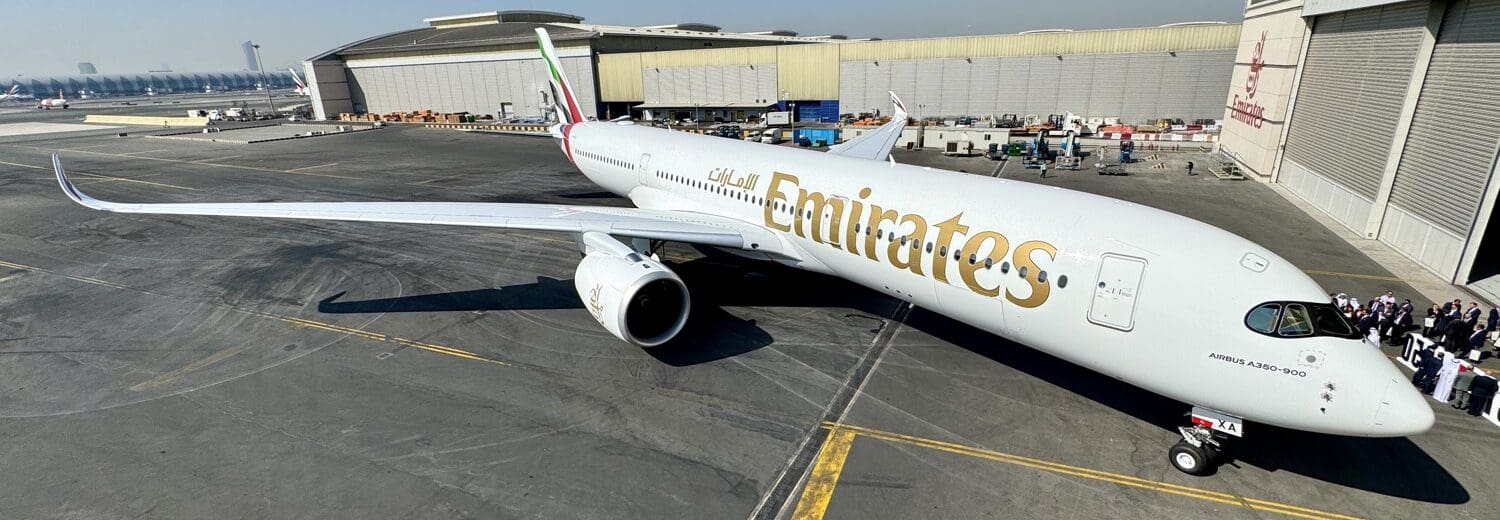 a large white airplane on a tarmac