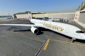 a large white airplane on a tarmac