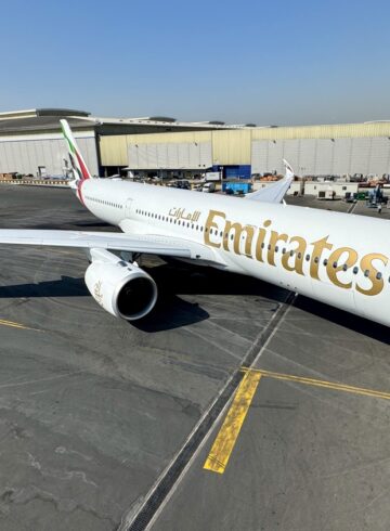 a large white airplane on a tarmac