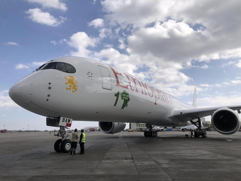 a large white airplane on a runway