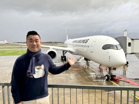 a man standing in front of a plane