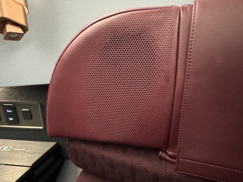 a close up of a red leather seat