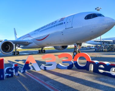 a large white airplane on a runway