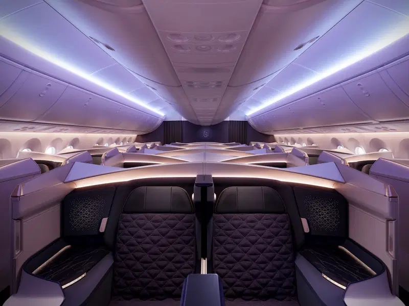 inside a plane with rows of seats