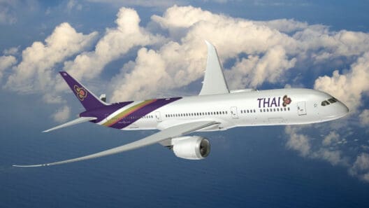 a white airplane flying in the sky