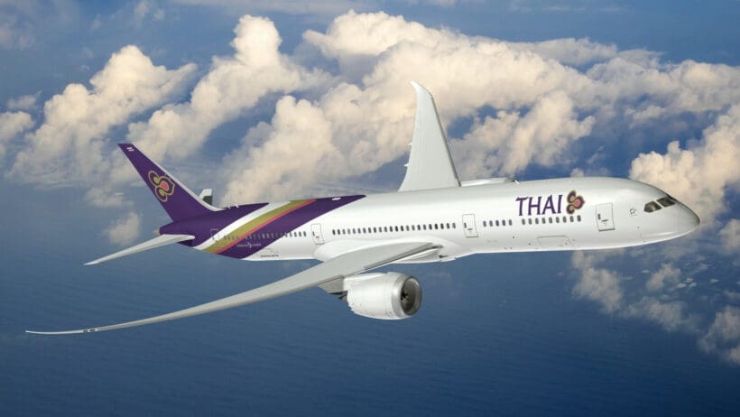 a white airplane flying in the sky