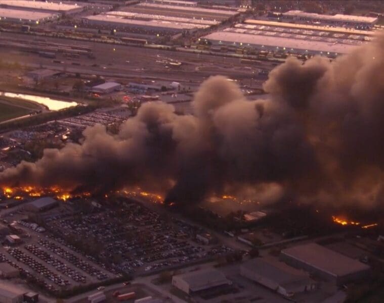 a building on fire with smoke coming out of it