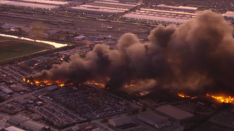 a building on fire with smoke coming out of it