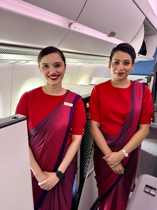 two women in red uniforms