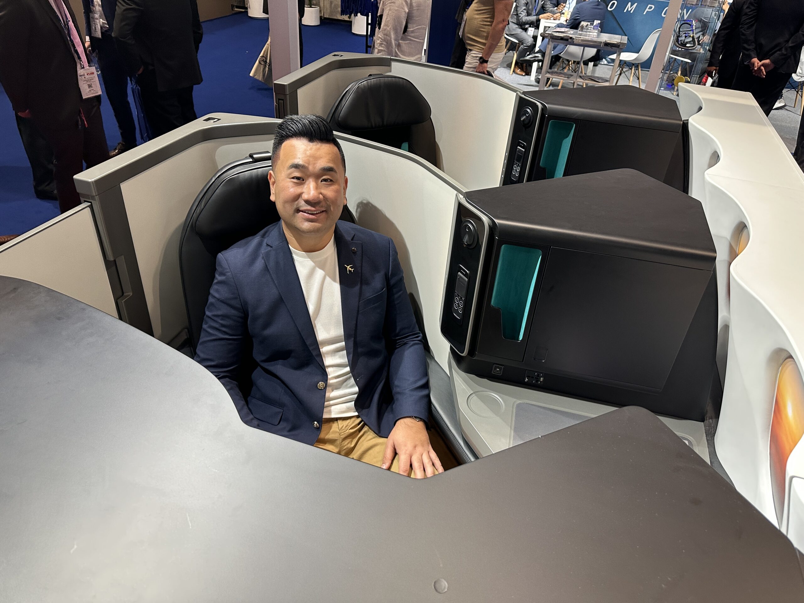 a man sitting in a chair with computer monitors