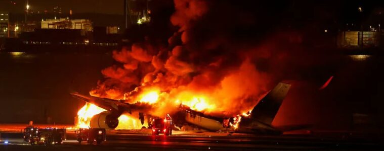 a plane on fire at night