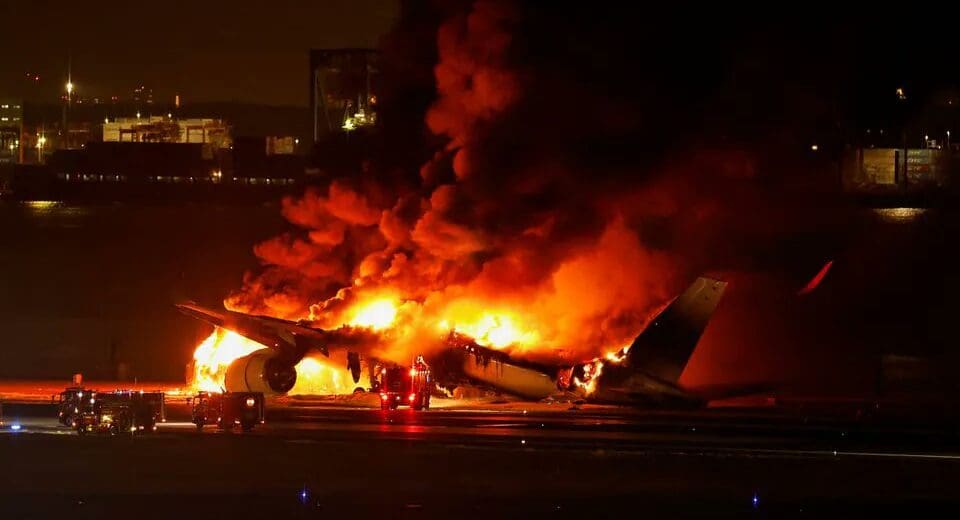 a plane on fire at night