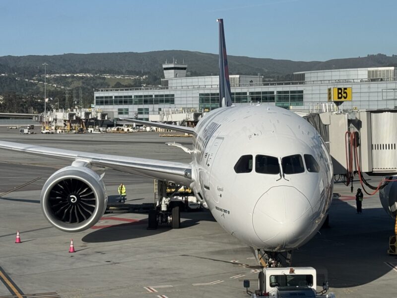a large white airplane parked at an airport