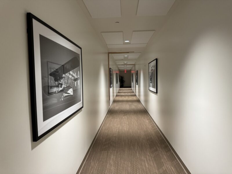 a long hallway with pictures on the wall