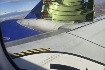 an airplane wing with an object on the wing