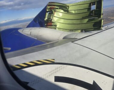 an airplane wing with an object on the wing
