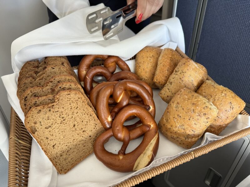 a basket of bread and pretzels
