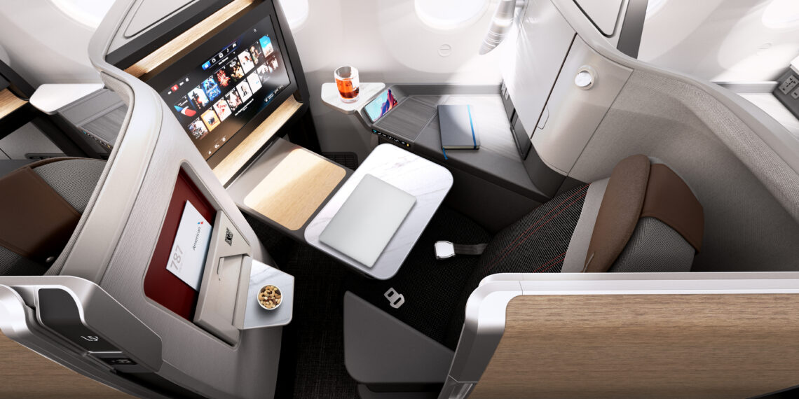 an airplane with a laptop and a tv