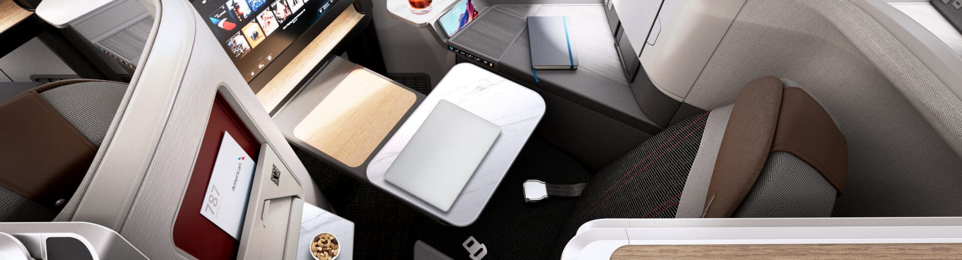 an airplane with a laptop and a tv