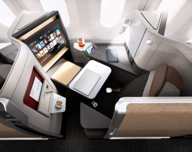 an airplane with a laptop and a tv