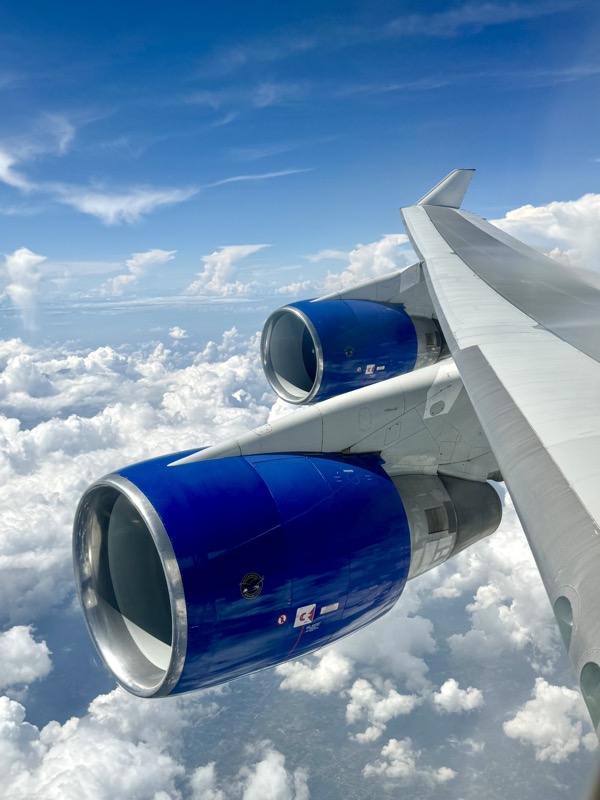an airplane wing with blue engines