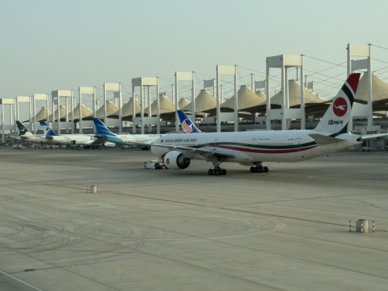 a group of airplanes on a runway