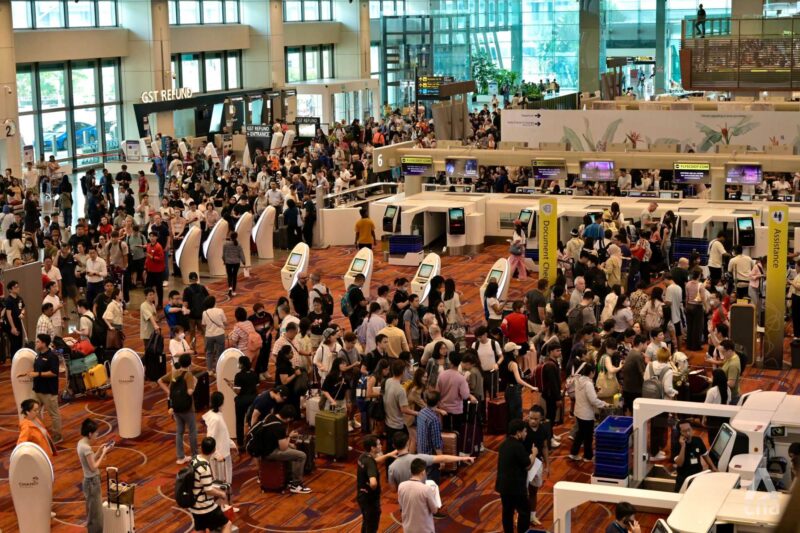 a large group of people in an airport